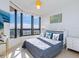 Bright bedroom with ocean view and comfortable bed at 1211 Gulf Of Mexico Dr # 706, Longboat Key, FL 34228