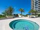 Relaxing hot tub surrounded by palm trees and ocean views at 1211 Gulf Of Mexico Dr # 706, Longboat Key, FL 34228