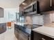 Modern kitchen with stainless steel appliances and stylish backsplash at 1211 Gulf Of Mexico Dr # 706, Longboat Key, FL 34228