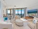 Bright living room with ocean views, comfortable seating at 1211 Gulf Of Mexico Dr # 706, Longboat Key, FL 34228