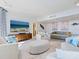 Elegant living room boasts ocean views and comfortable furnishings at 1211 Gulf Of Mexico Dr # 706, Longboat Key, FL 34228