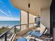 Spacious balcony boasting stunning ocean views and comfortable lounge chairs at 1211 Gulf Of Mexico Dr # 706, Longboat Key, FL 34228