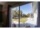 View of backyard from bedroom window showing patio and trees at 13634 7Th Avenue Ne Cir, Bradenton, FL 34212