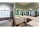 Modern bathroom with a large vanity, soaking tub, and walk-in shower at 13634 7Th Avenue Ne Cir, Bradenton, FL 34212