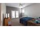 Bedroom with grey and white walls and french doors at 13634 7Th Avenue Ne Cir, Bradenton, FL 34212