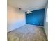 Bedroom with a ceiling fan and teal accent wall at 13634 7Th Avenue Ne Cir, Bradenton, FL 34212