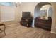 Open dining area with wood-look tile floors, fireplace, and built-in cabinetry at 13634 7Th Avenue Ne Cir, Bradenton, FL 34212