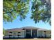 One-story house with columns, landscaping, and a dark gray roof at 13634 7Th Avenue Ne Cir, Bradenton, FL 34212