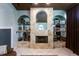 Stone fireplace with arched detailing and built-in shelves at 13634 7Th Avenue Ne Cir, Bradenton, FL 34212