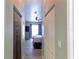 Hallway leading to the bedroom with wood-look floors at 13634 7Th Avenue Ne Cir, Bradenton, FL 34212