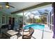 Bright pool area with screened enclosure and patio furniture at 13634 7Th Avenue Ne Cir, Bradenton, FL 34212