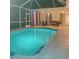 Lovely screened pool area with string lights, lit at night at 13634 7Th Avenue Ne Cir, Bradenton, FL 34212