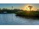 Tranquil sunset view over a calm waterway at 1862 Island Way, Osprey, FL 34229