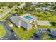 Community pool, shuffleboard courts, and clubhouse with ample parking at 4009 38Th Avenue W Dr # 4009, Bradenton, FL 34205