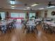 Common dining area with tables and chairs for residents at 4009 38Th Avenue W Dr # 4009, Bradenton, FL 34205