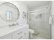 Modern bathroom featuring a glass-enclosed shower and vanity, designed with elegant fixtures and a sleek design at 151 Adair Ave, Sarasota, FL 34243