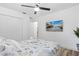 Comfortable bedroom with a TV and seashell bedding at 151 Adair Ave, Sarasota, FL 34243