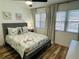 Bright bedroom with a queen bed and coastal decor at 151 Adair Ave, Sarasota, FL 34243