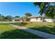 Charming single story home with landscaped yard and driveway at 151 Adair Ave, Sarasota, FL 34243