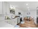 Modern kitchen with white cabinets, stainless steel appliances, and quartz countertops at 151 Adair Ave, Sarasota, FL 34243