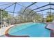 Private pool with a screened-in enclosure that provides a safe and relaxing environment at 151 Adair Ave, Sarasota, FL 34243