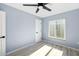 Bright bedroom featuring light walls and wood-look floors at 206 Beacon Harbour Loop, Bradenton, FL 34212