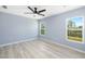 Spacious bedroom with light gray walls and wood-look flooring at 206 Beacon Harbour Loop, Bradenton, FL 34212