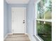 Bright entryway with white door and view to backyard at 206 Beacon Harbour Loop, Bradenton, FL 34212