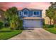 Two-story house with gray exterior and a two car garage at 206 Beacon Harbour Loop, Bradenton, FL 34212