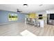 Open concept kitchen features stainless steel appliances and an island at 206 Beacon Harbour Loop, Bradenton, FL 34212