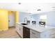 Kitchen island with white cabinets and quartz countertop at 206 Beacon Harbour Loop, Bradenton, FL 34212