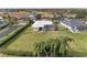 Aerial view showing house, pool, and surrounding landscape at 3522 Little Country Rd, Parrish, FL 34219