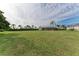 Spacious backyard with large grassy area and a view of the house at 3522 Little Country Rd, Parrish, FL 34219