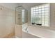 Large bathroom with a shower and a separate soaking tub at 3522 Little Country Rd, Parrish, FL 34219