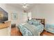 Guest bedroom with a queen-size bed and wood dresser at 3522 Little Country Rd, Parrish, FL 34219