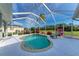 Screened-in pool with lounge chair and lush landscaping at 3522 Little Country Rd, Parrish, FL 34219