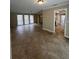 Open living space showcasing tile flooring and an adjacent kitchen at 4409 Eleuthera Ct, Sarasota, FL 34233