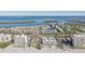 Aerial view of coastal community with beach and various building styles at 4440 Exeter Dr # N304, Longboat Key, FL 34228