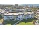 Aerial view of condo building with ocean and beach views at 4440 Exeter Dr # N304, Longboat Key, FL 34228