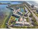 Aerial view of waterfront community with pool and parking at 4440 Exeter Dr # N304, Longboat Key, FL 34228