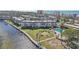 Aerial view of waterfront condo community with pool and boat docks at 4440 Exeter Dr # N304, Longboat Key, FL 34228