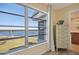 Bedroom with water views and dresser at 4440 Exeter Dr # N304, Longboat Key, FL 34228