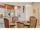 Cozy dining area, wooden table, and pass-through kitchen at 4440 Exeter Dr # N304, Longboat Key, FL 34228