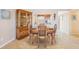 Charming dining area with wooden table and kitchen access at 4440 Exeter Dr # N304, Longboat Key, FL 34228