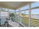 Serene lanai boasting water views and lounge chair at 4440 Exeter Dr # N304, Longboat Key, FL 34228