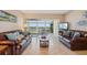 Relaxing living room with leather sofas and water views at 4440 Exeter Dr # N304, Longboat Key, FL 34228