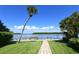 Brick pathway leads to a private dock with scenic water views at 4440 Exeter Dr # N304, Longboat Key, FL 34228