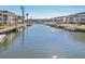 Waterfront view of boats docked along a canal, showcasing a serene waterfront community at 4440 Exeter Dr # N304, Longboat Key, FL 34228