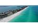 Aerial view of Anna Maria Island beach and waterfront homes at 4557 Bay Club Dr, Bradenton, FL 34210