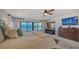 Bright bedroom with water views and a king-size bed at 4557 Bay Club Dr, Bradenton, FL 34210